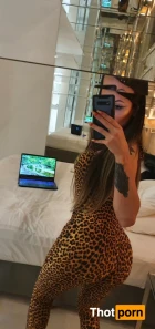 12557980